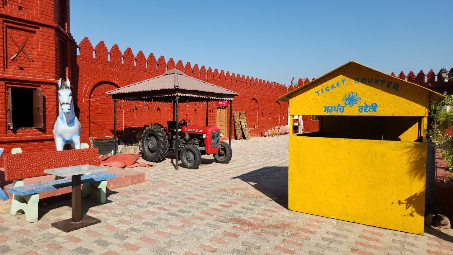 A tractor display beside the courtyard ticket counter.