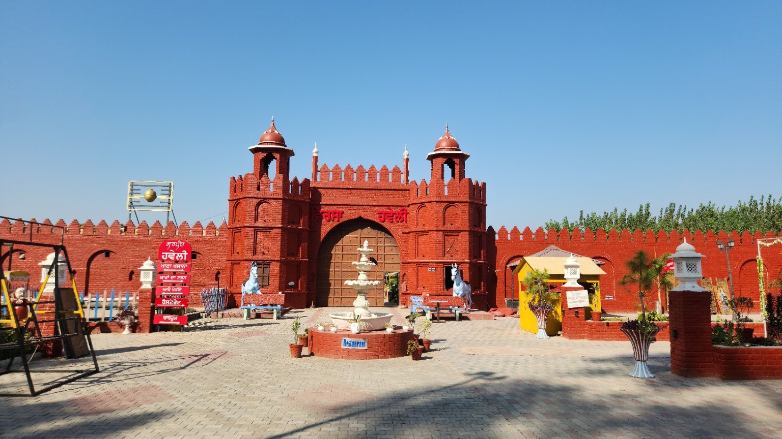 Sarpanch Haveli’s striking red gateway.